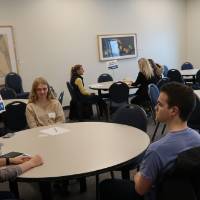 Alumni volunteers talking about their experiences at the 30 Minute Mentors Event